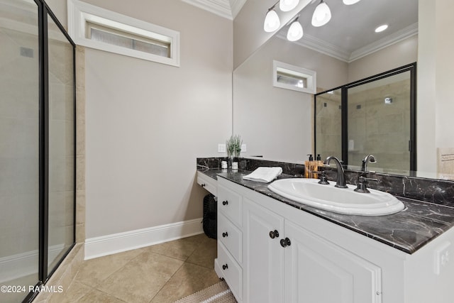 bathroom featuring crown molding, vanity, an enclosed shower, and tile patterned floors