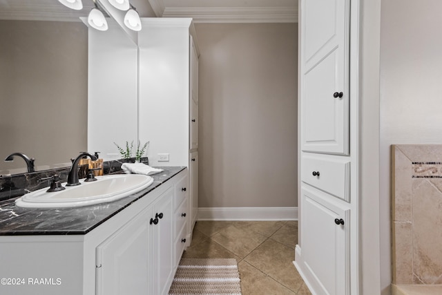 bathroom featuring vanity, ornamental molding, and tile patterned floors