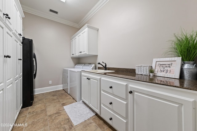 clothes washing area featuring cabinets, separate washer and dryer, light tile patterned floors, crown molding, and sink