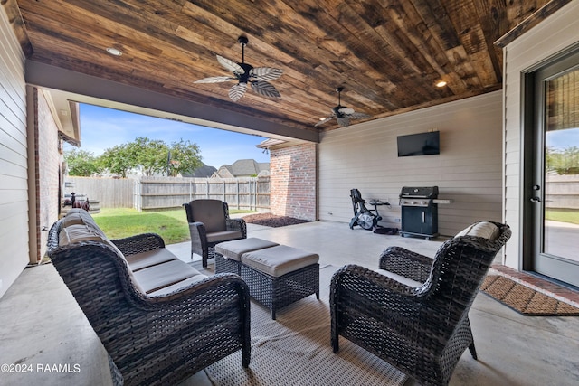 view of patio / terrace with an outdoor living space, area for grilling, and ceiling fan