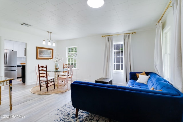 living room with light hardwood / wood-style floors