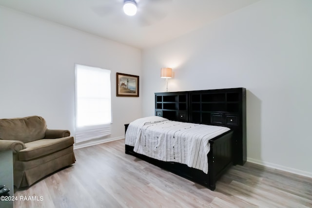 bedroom featuring ceiling fan and light hardwood / wood-style flooring