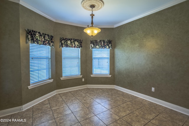 tiled empty room featuring crown molding