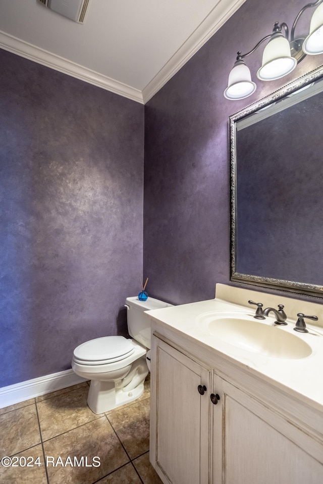 bathroom featuring crown molding, vanity, toilet, and tile patterned floors