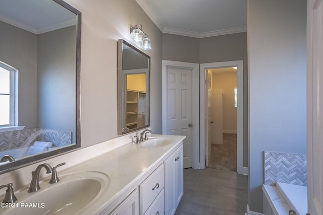 bathroom featuring ornamental molding, vanity, a tub, and tile patterned flooring