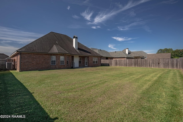 view of yard with central AC