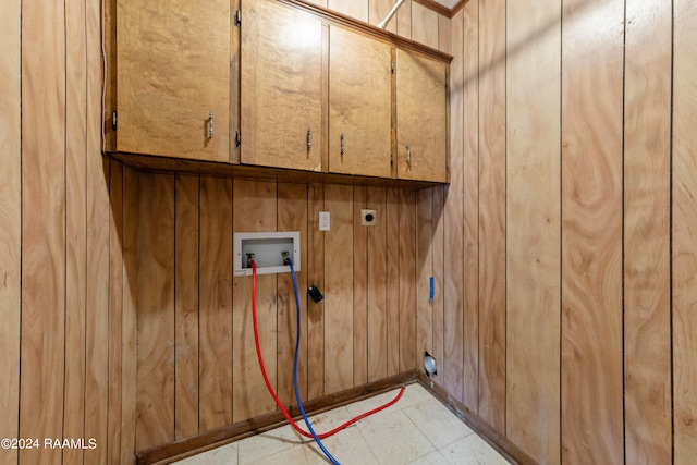 laundry area with washer hookup, hookup for an electric dryer, cabinets, and light tile patterned flooring