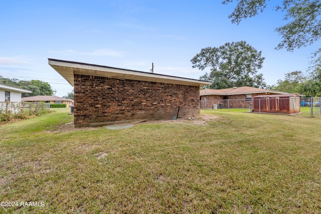 back of house with a yard