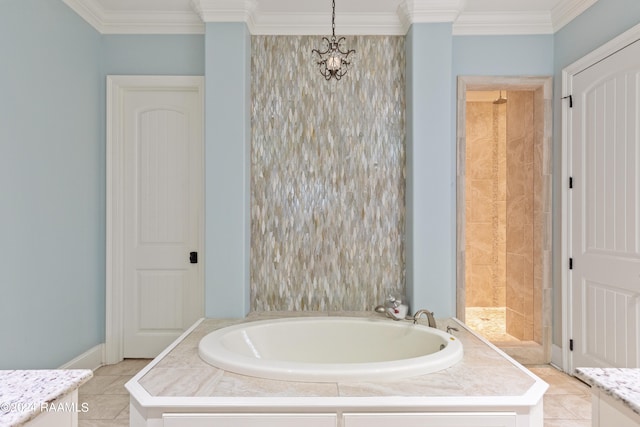 bathroom with a tub to relax in, vanity, ornamental molding, and tile patterned flooring