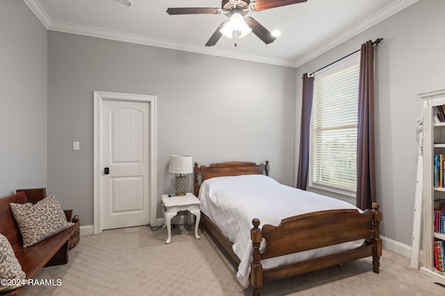 bedroom featuring light colored carpet, ceiling fan, ornamental molding, and multiple windows