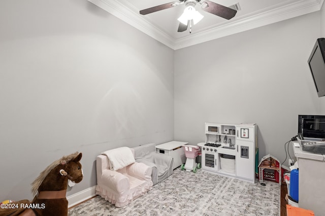 game room with ceiling fan, light colored carpet, and ornamental molding