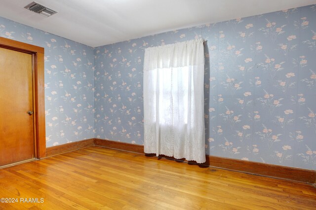 unfurnished room featuring light hardwood / wood-style floors