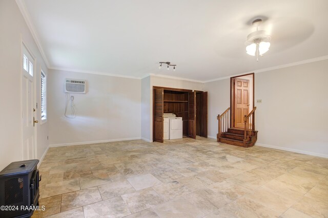 bedroom with a wall mounted AC, crown molding, separate washer and dryer, and ceiling fan