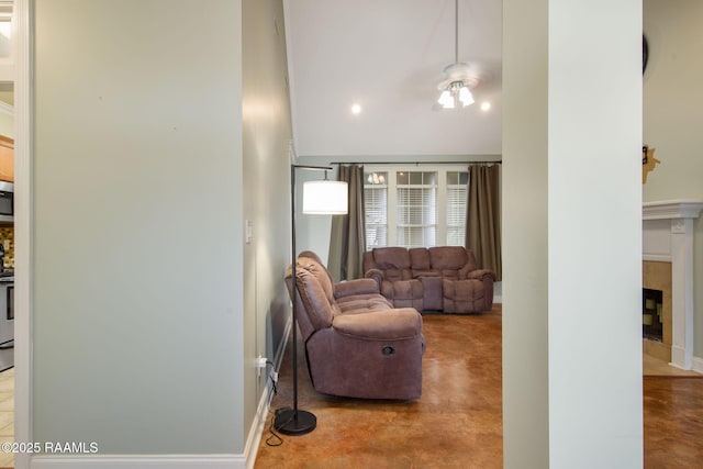 living room featuring a tiled fireplace