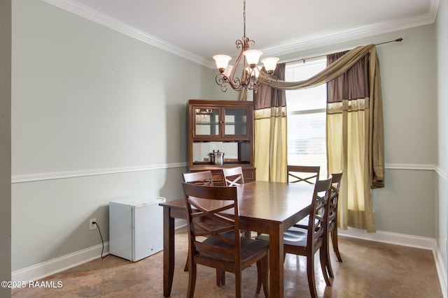 dining room with ornamental molding and a notable chandelier