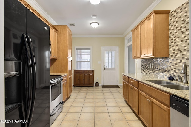 kitchen with crown molding, appliances with stainless steel finishes, sink, and light stone counters