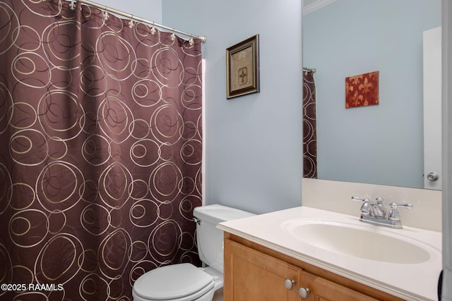 bathroom featuring vanity and toilet