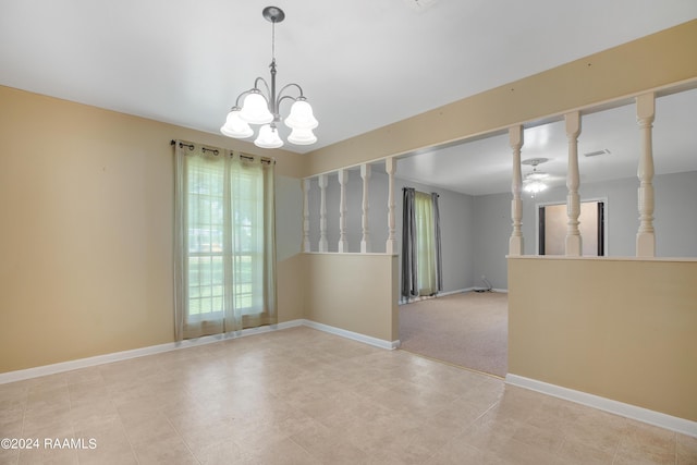 unfurnished room with baseboards and ceiling fan with notable chandelier
