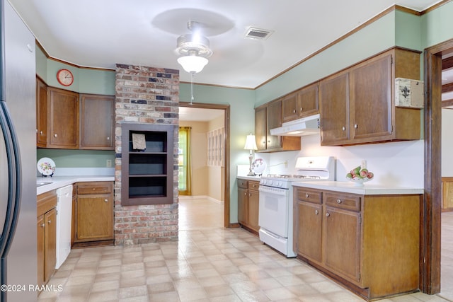 kitchen featuring light countertops, crown molding, white appliances, under cabinet range hood, and visible vents