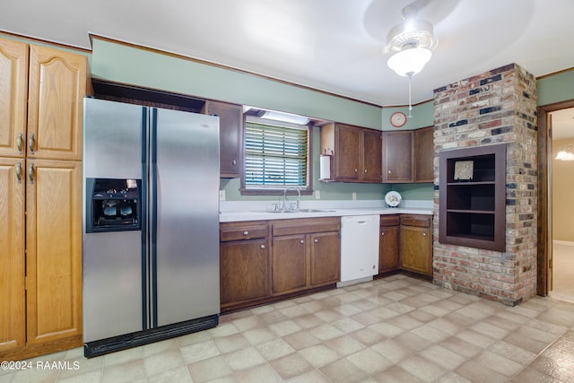 kitchen with light countertops, stainless steel fridge, a sink, ceiling fan, and white dishwasher