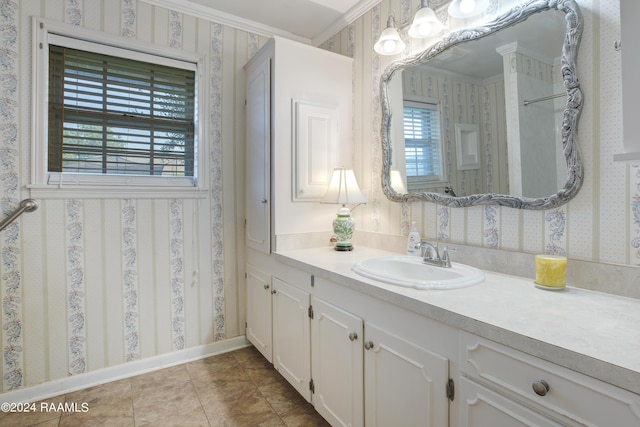 bathroom featuring vanity, crown molding, baseboards, wallpapered walls, and tile patterned floors