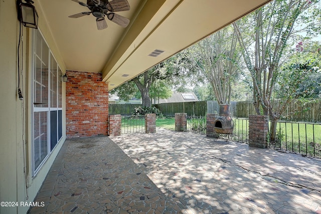 view of patio featuring a fenced backyard, ceiling fan, and visible vents