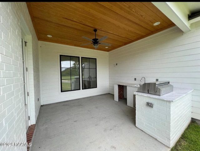 view of patio / terrace with area for grilling, ceiling fan, and sink