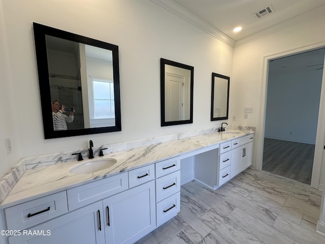 full bath featuring a sink, visible vents, double vanity, and crown molding