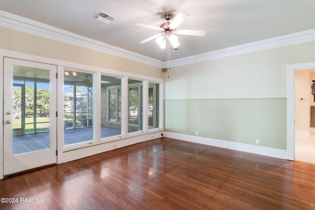 spare room with crown molding, dark hardwood / wood-style flooring, and ceiling fan