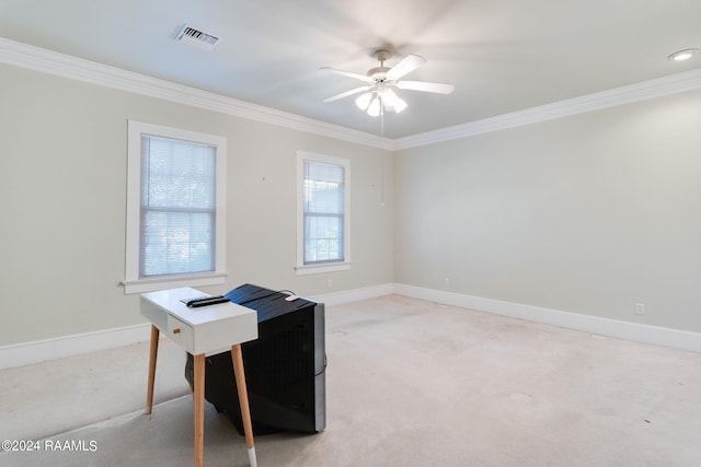 carpeted office space featuring ceiling fan and ornamental molding