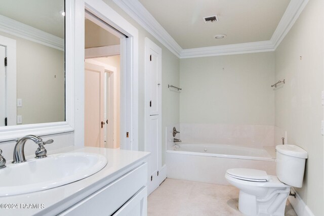 bathroom with a bathing tub, crown molding, vanity, and toilet