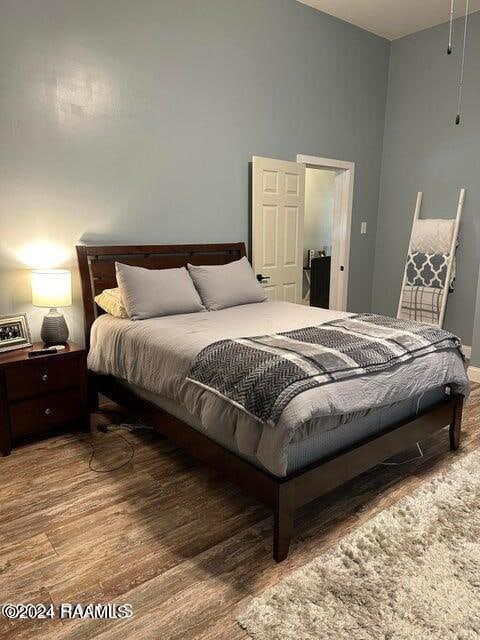 bedroom featuring hardwood / wood-style flooring