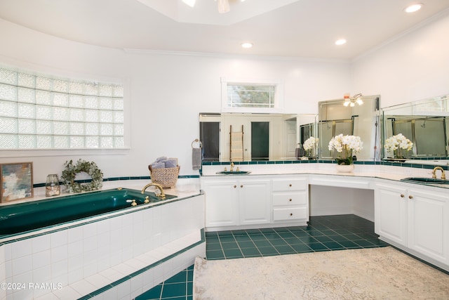 bathroom featuring tile patterned floors, crown molding, vanity, a bath, and recessed lighting