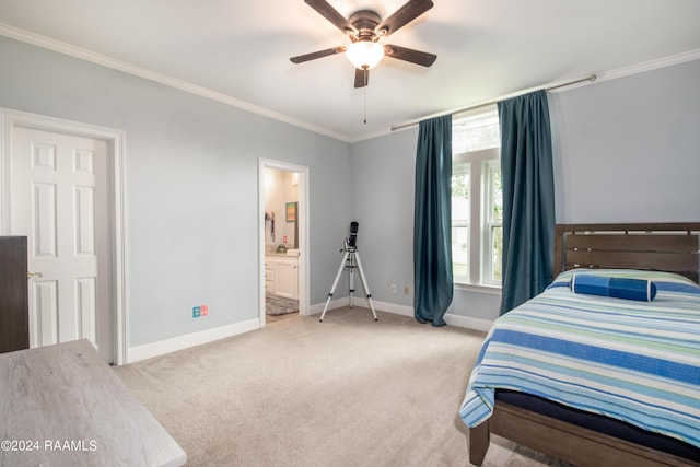 carpeted bedroom featuring ensuite bath, ornamental molding, and ceiling fan