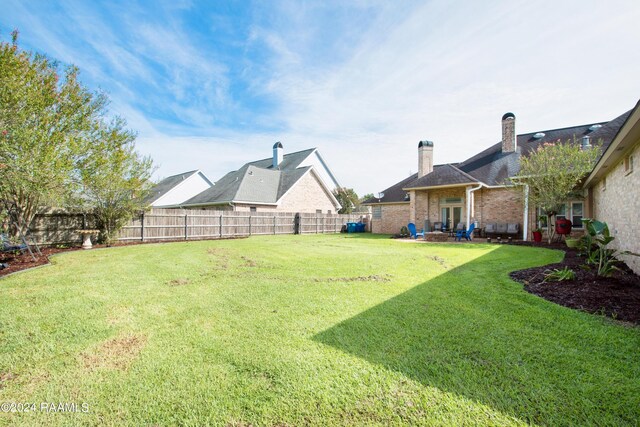 view of yard with a fenced backyard