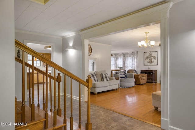 interior space featuring ornamental molding, hardwood / wood-style floors, and a chandelier