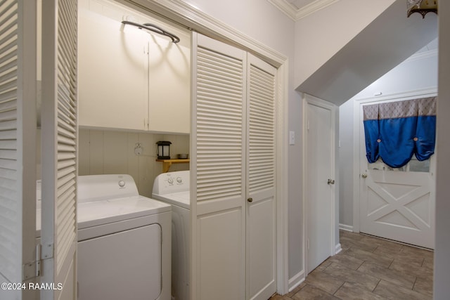 laundry room with crown molding and washer and dryer