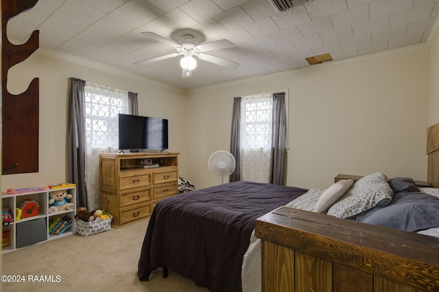 bedroom featuring crown molding, light carpet, multiple windows, and ceiling fan