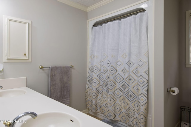 bathroom with vanity and crown molding