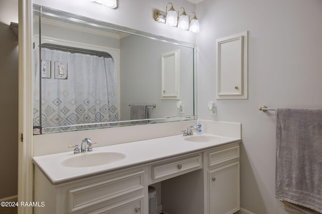 bathroom with vanity and ornamental molding