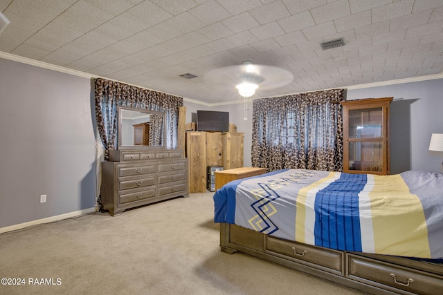 bedroom with crown molding, carpet floors, and ceiling fan