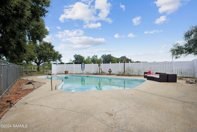 view of pool featuring a patio