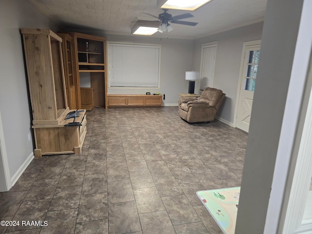 sitting room featuring ceiling fan