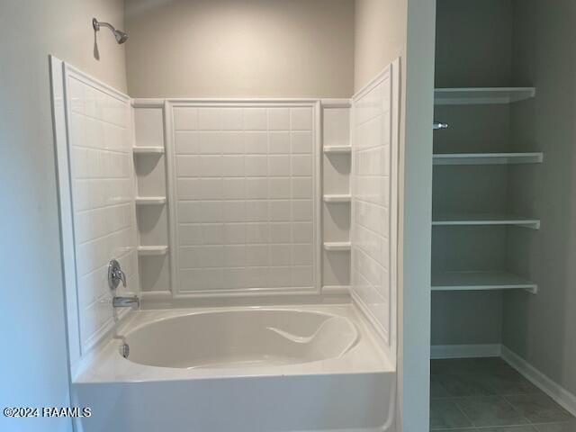 full bath featuring shower / bathing tub combination, baseboards, and tile patterned flooring