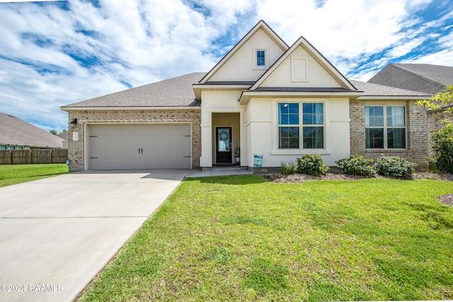 view of front facade featuring a front lawn and a garage