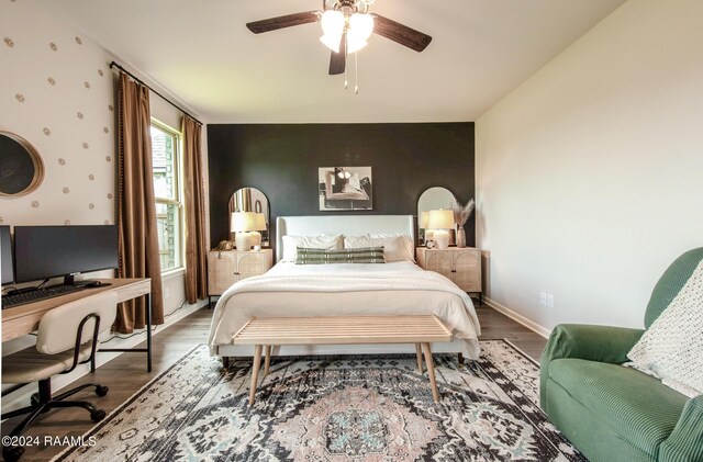 bedroom with ceiling fan and hardwood / wood-style floors