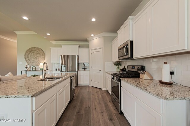 kitchen featuring dark hardwood / wood-style floors, crown molding, stainless steel appliances, sink, and white cabinetry