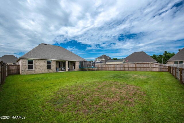 view of yard with a patio area and a trampoline