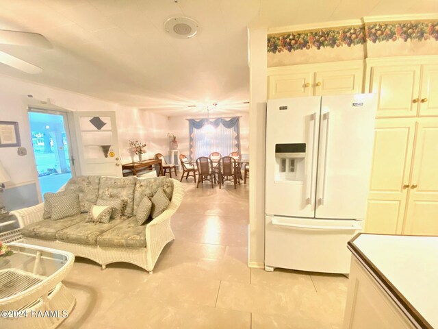 interior space featuring ceiling fan and a wealth of natural light