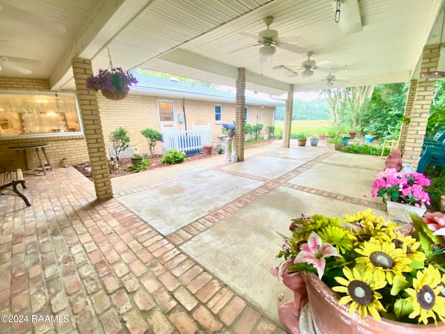 view of patio featuring ceiling fan